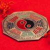 close-up shot of traditional chinese yin and yang talisman on red surface