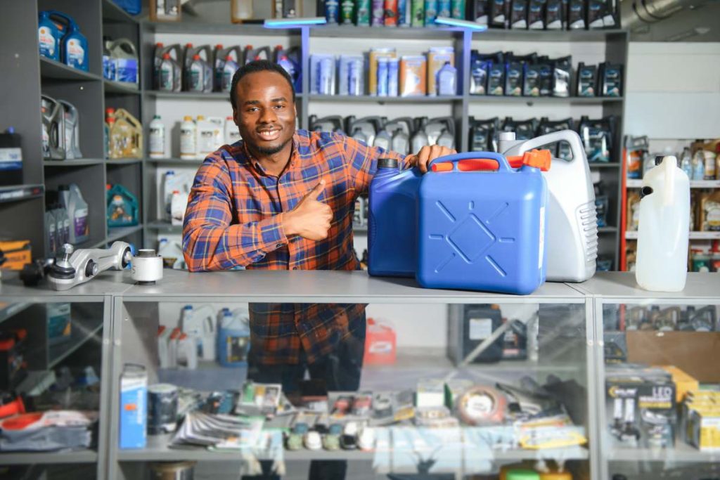 man with AdBlue in auto store.