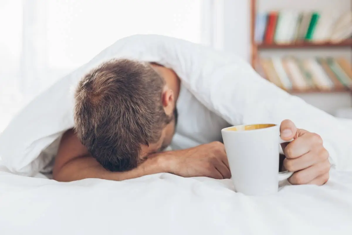 Man trying to wake up in the morning after night out