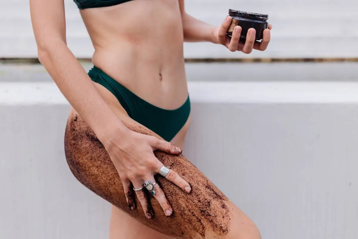 Outdoor shot of woman with coffee body scrub