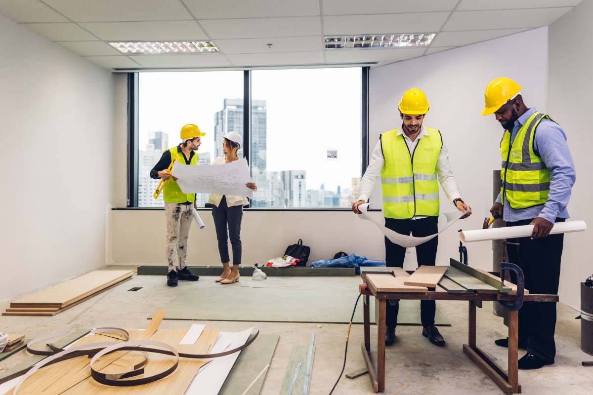 Team Engineers with draft plan of building on constructing site. Engineer work on site. engineer visit and inspection site engineer. Inspector engineer check and working on site.