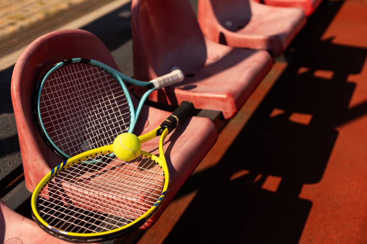 tennis racket with tennis balls on a tennis court. High quality photo